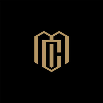 MC monogram logo with gold color