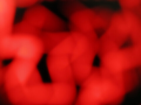 red glowing blurry zig zag neon lines abstract background