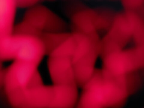 red pink glowing blurry zig zag neon lines abstract background