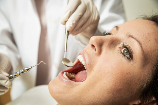 Young Woman Receiving a Routine Dental Examination