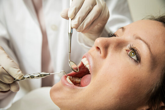 Young Woman Receiving a Routine Dental Examination
