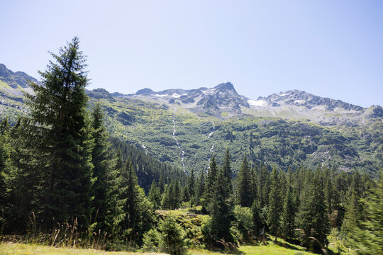 Mountain landscapes with trees and rocks and a lake