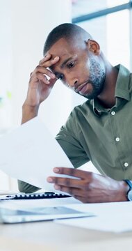 Office, document and man with stress, reading and bad news on paperwork or real estate fail. Property investor, anxiety and headache with rejected loan application, strain or overworked crisis