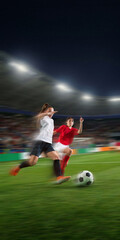 Naklejka premium Football player dribbling past defender with motion blur in night arena. Concept of soccer skills training, sportswear ads, match graphics, academy promo and performance content.