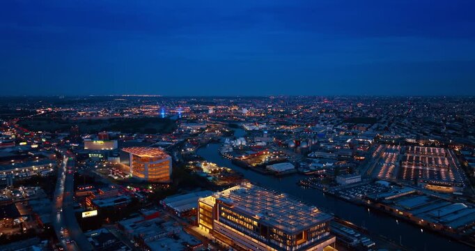 Lively urban landscape lit by beautiful city lights. Night scenery of New York City from drone.