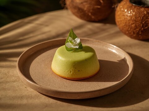 Generative AI portrays a delicate, pastel-colored dessert with green and yellow hues on a simple