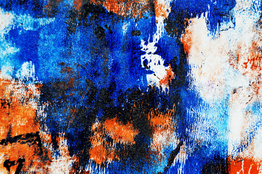 Vibrant grunge abstract background with bold orange, blue and violet acrylic messy paint strokes, distressed monoprint details and expressive contemporary art energy for posters, banners covers design
