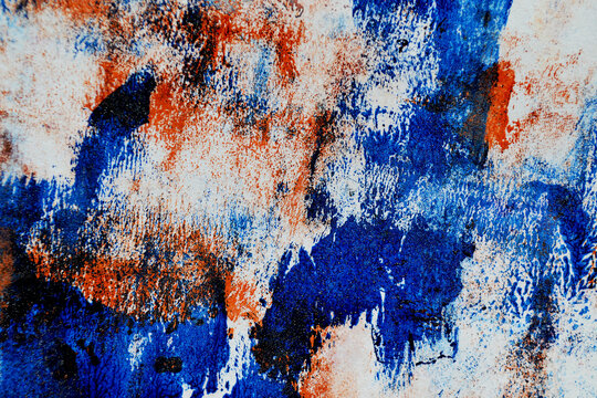 Vibrant grunge abstract background with bold orange, blue and violet acrylic messy paint strokes, distressed monoprint details and expressive contemporary art energy for posters, banners covers design