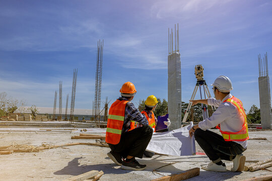 Structural engineer, architect and foreman worker with blueprints discuss, plan working for the outdoors building construction site. Construction collaboration concept