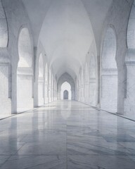 Obraz premium Symmetric white marble corridor with pointed arches to vanishing point