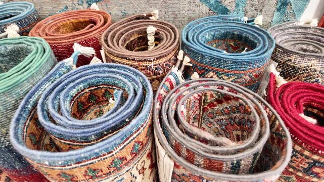Handcrafted rugs for sale at local market in autumn