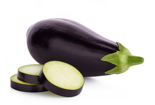 One fresh whole and sliced eggplant or aubergine on white background