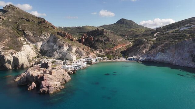 Aerial drone view of Firopotamos fishing village coastline, Milos island, Greece
