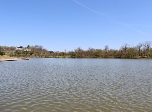 The quiet lake in the park on a sunny day.