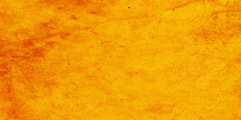 Naklejka premium Vibrant orange textured background with subtle scratches and imperfections