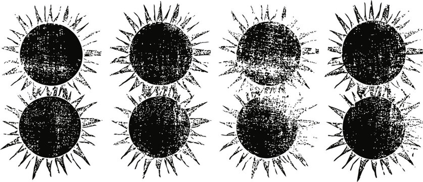set of eight vintage black suns with grunge texture and rays on white background