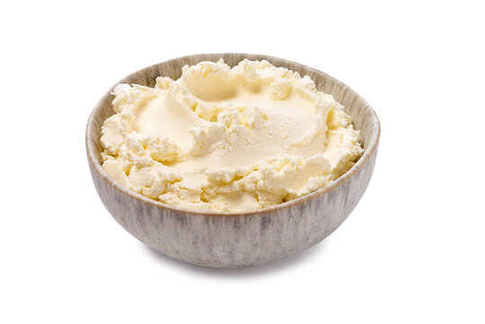 Ceramic dish holding fluffy cream cheese. Artisanal whipped cheese displayed in elegant ceramic container