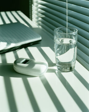 Digital analyzer home test tabletop white device glass water notebook window blind sunbeam shadow line