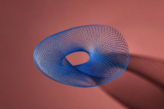 Blue wireframe torus floating on a pink background with soft shadow in abstract 3D minimal composition