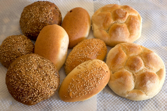 Assortment of fresh bread rolls on a dining table