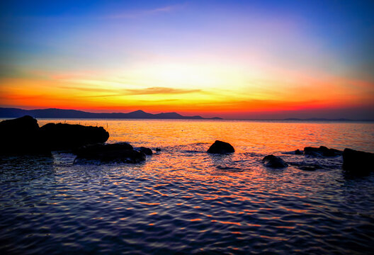 Sunsets over ocean. Tranquil sunset on Phu Quoc Island, Vietnam. Tranquil landscape overlooking waterway in Albania (Qeparo) and even from Vancouver, Canada.