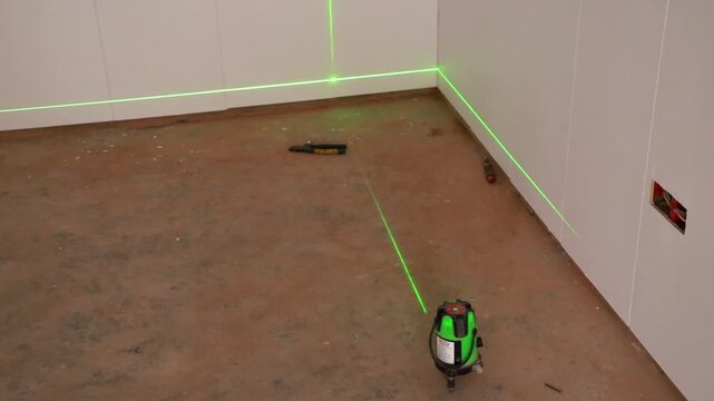 Green Laser Level Tool on Workshop Floor