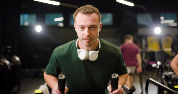Group of friends exercising at a fitness center, enjoying time together while pushing their limits during group workouts