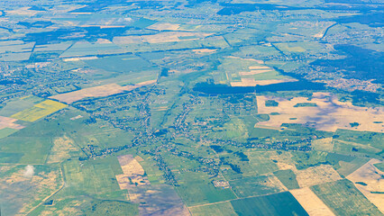 Naklejka premium Bird's eye view of rural area with fields and small towns during daytime in North America