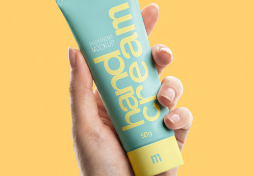 Hand Cream Tube Mockup Held by Hand