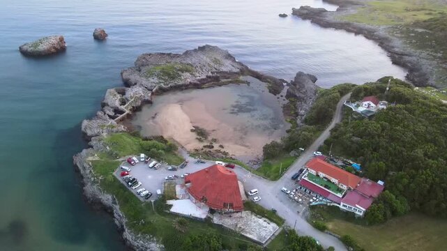 Aerial video of the harbour at Las Arenillas beach in Islares, Castro Urdiales, Cantabria