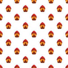 Obraz premium Repeating pattern of small cartoon huts with red roofs, offering a whimsical background