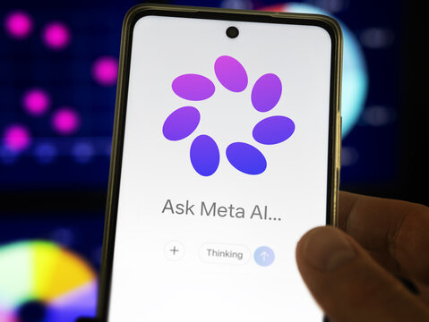 Meta AI, user looking at Meta AI service on his phone.