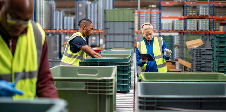 Warehouse workers using digital tablets for inventory management with warehouse logistics inventory management shipping distribution operation technology scanning fulfillment handling