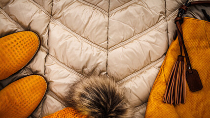 Warm clothing and accessories arranged on a soft blanket during cool weather in autumn or winter season © Fleuronica