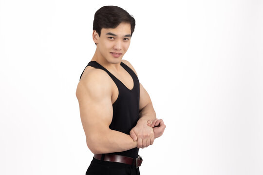 Shirtless young man flexing his arm muscles
