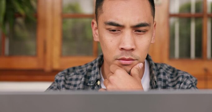 Man, thinking and working on laptop in business, plan or problem solving for work strategy at home. Focused and serious male web designer employee worker reading, code or email on computer