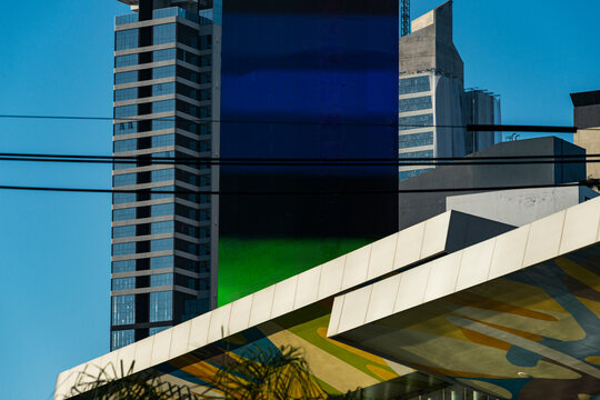 Layered skyline combines blue tower, digital cylinder and diagonal architectural plane