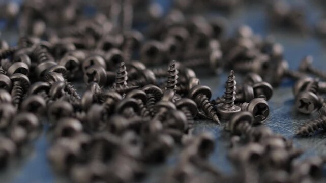 Metal screws for fastening equipment. Soft focus. Close-up. 