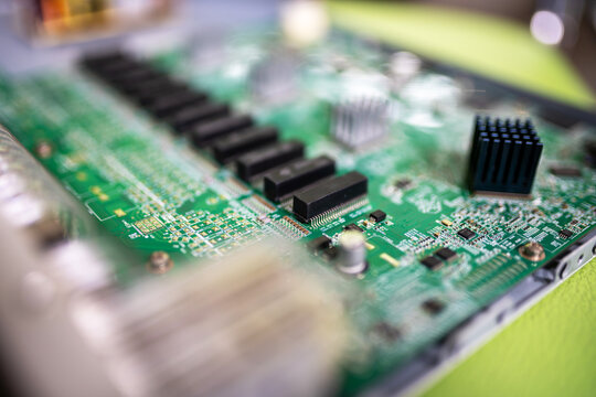 Close-up view of a computer motherboard with various electronic components and connectors