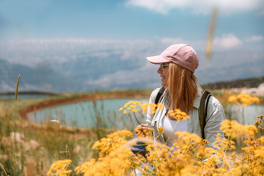 Female Traveler with Yellow Wildflowers