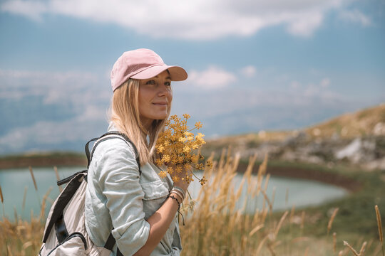 Female Traveler with Yellow Wildflowers