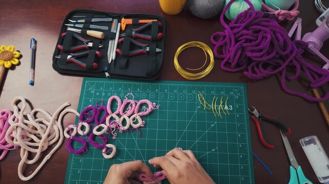 Artisan crafting handmade wire wrapped jewelry