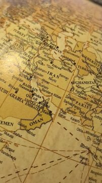 Experience a close-up view of a beautifully detailed globe as it rotates gracefully. Discover the vibrant countries, continents, and cities that make up our diverse world.
