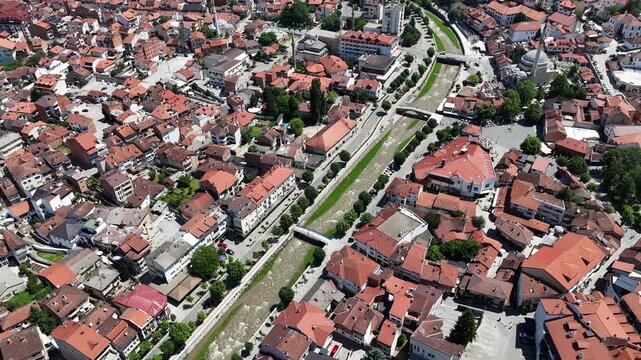 Beautiful aerial drone footage of Prizren and its river captured on a sunny day, featuring historic architecture, charming bridges, flowing water, and vibrant city life in one of Kosovo&rsquo;s most picture