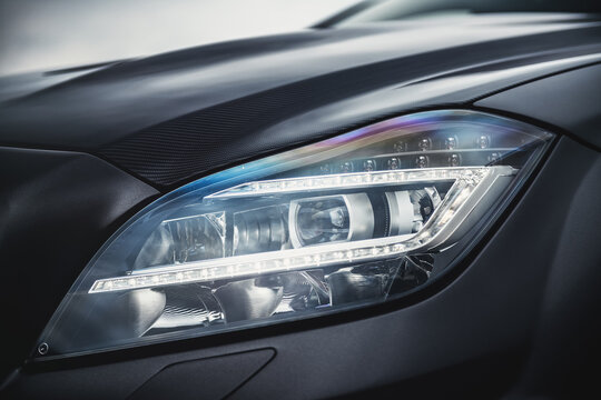 Luxury car headlight featuring modern led technology and carbon fiber
