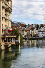 Obraz premium Gave de Pau river crossing the city center of Lourdes