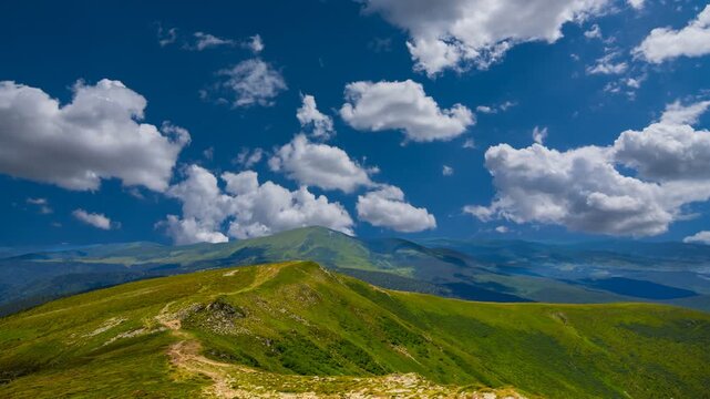 green mountain backbone under a cloudy sky time lapse scene
