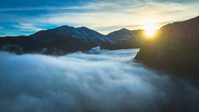 Aerial Mt Charleston Cloud Inversion Sunburst Over Mountains At Golden Hour