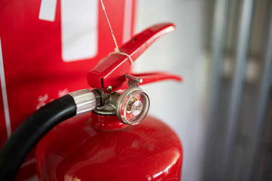 Fire Extinguisher Mounted on Wall in Building