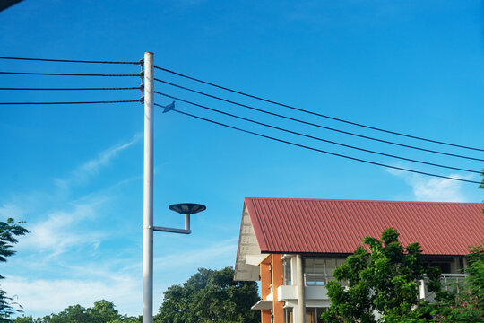 Residential neighborhood with utility pole and clear sky